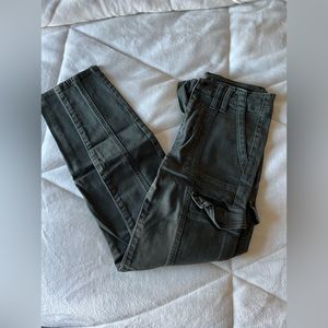 Army green American eagle jeans.